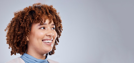 Image showing Thinking, space and happy with face of woman in studio for idea, promotion and mockup. Smile, banner and announcement with female person on grey background for happiness, news and advertising