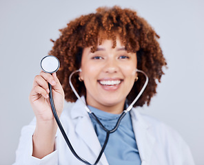 Image showing Healthcare, stethoscope and portrait of woman doctor in studio for hospital check up on grey background. Cardiology, health and face of lady cardiologist with heart, lungs and heartbeat medical tool