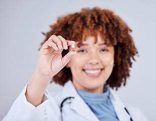 Image showing Medicine, pills and doctor with portrait of woman in studio for prescription, supplements or medical. Healthcare, pharmacy and product with female pharmacist on white background for wellness and cure