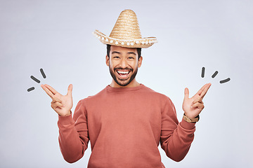 Image showing Finger gun, hat and portrait of man in studio with hand gesture for comic, humor and funny joke. Happy, Mexican party accessories and excited male person on gray background with sombrero for comedy