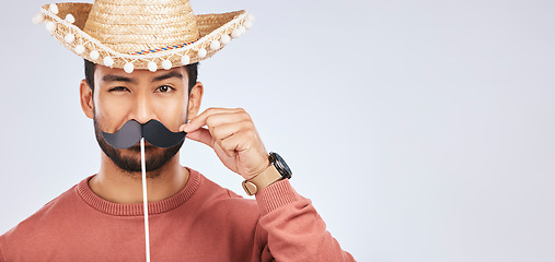 Image showing Photo booth mockup, sombrero and portrait of man with mustache for comic, humor and funny joke. Costume, Mexican party accessory and silly face of male person on gray background with hat for comedy