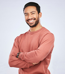 Image showing Portrait, smile and Asian man with arms crossed, casual fashion and confident guy against a white studio background. Face, male person and Japanese model with happiness, aesthetic and stylish outfit