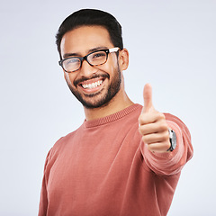 Image showing Thumbs up, portrait and asian man with hands for success in studio, white background and winning news. Happy male model with glasses, ok emoji and like feedback, good review and vote yes in agreement