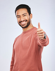 Image showing Thumbs up, portrait and man vote for success in studio, white background and thank you. Happy asian male model, thumb emoji and support of winning, like and motivation of feedback, good review or yes