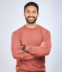 Image showing Portrait, happy or confident Asian man with arms crossed or smile in studio in casual fashion or clothes. Relax, satisfied or friendly handsome person smiling on white background with pride or joy