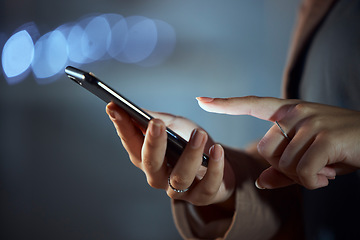 Image showing Woman, hands and phone at night for communication, social media or browsing in the city. Closeup of female person or employee working late on mobile smartphone app for online chatting or texting