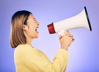 Image showing Megaphone, voice and young woman with human rights, equality and freedom of speech or strong opinion. Person protest, call to action and change or justice with noise on studio or purple background