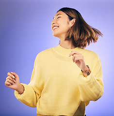 Image showing Happy asian woman, dance and music in freedom or casual fashion against a purple studio background. Female person or model smile enjoying energy, event or party in happiness for clothing on mockup