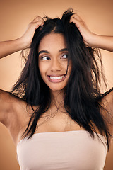 Image showing Mess, hair and face of woman in studio with haircare problem, damaged texture and split ends crisis. Salon, beauty and worried female person with hands on head for treatment, hygiene and cleaning