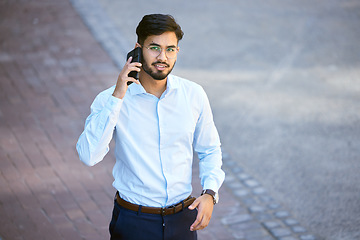 Image showing Portrait, indian man and phone call with professional in outdoor for communication with career. Tech, travel and businessman in city or portrait with conversation for technology or work in street.