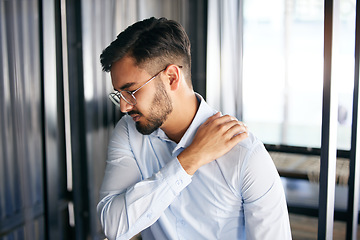 Image showing Business man, shoulder pain and problem with health issue and muscle fatigue in an office. Employee, young and male person, professional and injury of worker feeling tired from inflammation at work
