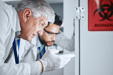 Image showing Senior scientist, team and pointing in lab for analysis, experiment results and partnership for virus growth. Science men, teamwork and study for medical research with hazardous bacteria in hospital