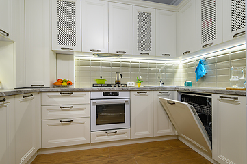 Image showing White kitchen in classic style, oven door is open