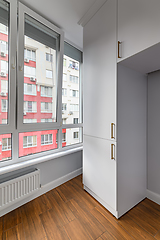 Image showing Empty heated penthouse living room with floor to ceiling windows