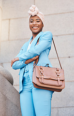 Image showing Happy, pride and portrait of a black woman with arms crossed in the city as a lawyer. Smile, confident and an African employee or justice worker working in town as a professional legal entrepreneur