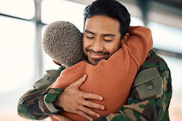 Image showing Love, hug and a man soldier with his wife in the airport after returning home from war service as a patriot. Smile, military or army with a happy couple embracing as a welcome to safety and security