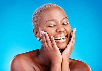 Image showing Face makeup, smile and happy black woman with facial application, aesthetic cosmetics and skincare hydration glow. Beauty eyeliner, collagen shine and African studio person on blue background.