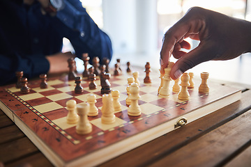 Image showing Hands, fun and people with a chess game, strategy and playing together at a competition. Table, professional and friends with a board for gaming, learning and expert with a skill or hobby in a room