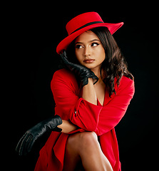 Image showing Woman, retro red fashion and glamour in studio with vintage beauty and wealth. Young female person, black background and luxury style with cosmetics, designer rich clothes and model with confidence