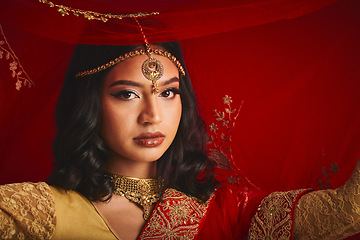 Image showing Fashion, veil and portrait of Indian woman with jewellery in traditional clothes, beauty and sari. Religion, culture and face of female person on red background with accessory, cosmetics and makeup