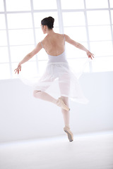 Image showing Dance, ballet and training with woman in studio for balance, elegant and performance. Artist, theatre and creative with female ballerina dancing in class for competition, freedom and commitment