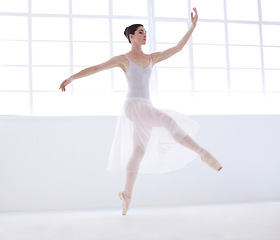 Image showing Performance, ballet and creative with woman in studio for balance, elegant and dance. Artist, theatre and training with female ballerina dancing in class for competition, freedom and commitment