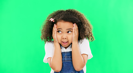 Image showing Fear, worried and mistake with a girl on a green screen background in studio feeling nervous or anxious. Portrait, scared and panic with an adorable little female child looking afraid on chromakey