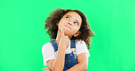 Image showing Thinking, green screen and a child with a decision isolated on a studio background. Doubt, think and a confused girl kid looking thoughtful, contemplating and planning an idea with mockup space