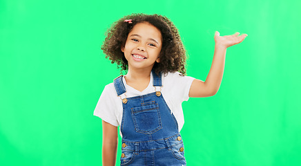 Image showing Face, wave and girl greeting, welcome and green screen with happiness, hello and carefree. Portrait, female child and young person with welcome, excited and joyful with hi, facial expression or smile