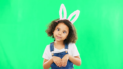 Image showing Kids, easter and playful with a girl on a green screen background in studio feeling silly while having fun. Children, bunny and holiday with a cute little female child playing on chromakey mockup