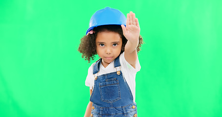 Image showing Stop, construction and face of a child on a green screen isolated on a studio background. Safety, security and portrait of a girl kid with a warning hand for building, renovation and maintenance