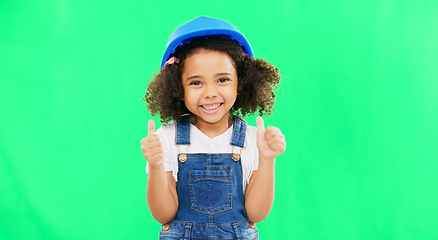 Image showing Little girl, thumbs up and construction with safety helmet on green screen for good job against a studio background. Portrait of architect kid showing thumb emoji, yes or like for success on mockup