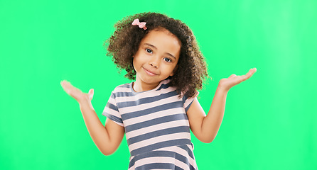 Image showing Confused, question and child shoulder shrugging and unsure raise arms isolated in a studio green screen background. Portrait, girl and clueless young kid with doubt reaction or hand gesture