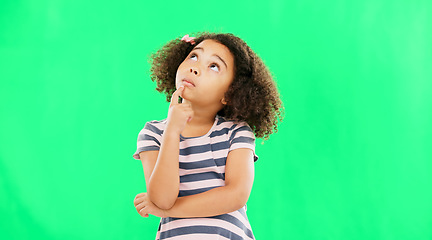 Image showing Thinking, idea and green screen with young girl in a studio contemplating and relax planning. Question, youth thought and kid with ideas and creative vision feeling curious with contemplation