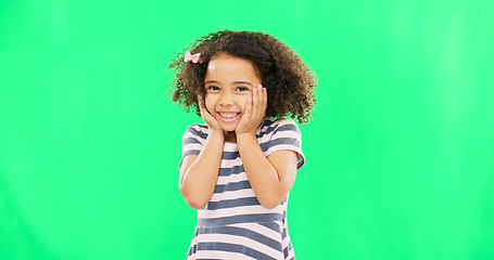 Image showing Cute, happy and the face of a child on a green screen isolated on a studio background. Smile, laughing and portrait of an adorable little girl looking cheerful, playful and expressing happiness