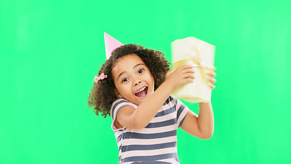 Image showing Gift box, excited girl and green screen of a happy child with a birthday present in a studio. Celebration, youth and happiness of a kid shaking a package with a smile and energy from party gifts
