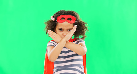 Image showing Superhero, child and stop sign on green screen with hands to fight crime with fantasy or cosplay costume. Girl power, hero and pretend game with strong kid x portrait to protect freedom and justice