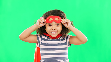 Image showing Happy child, superhero and portrait on green screen with a smile to fight with fantasy, dream or cosplay costume. Girl power, hero and game with strong kid to protect freedom and justice with a mask