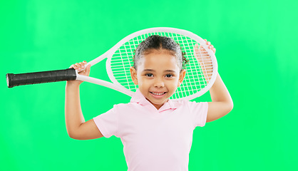 Image showing Children, tennis and a girl on a green screen background in studio for sports, recreation or fun. Portrait, kids and fitness with an adorable little female child or athlete on chromakey mockup