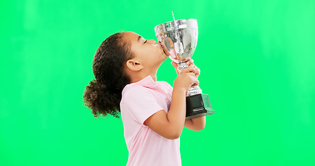 Image showing Celebration, win and face of child with trophy isolated on a green screen studio background. Excited, success and portrait of a girl kissing an award for sports, achievement and champion with mockup