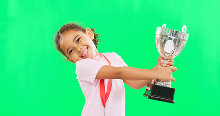 Image showing Happy, winning and face of child with a trophy isolated on a green screen studio background. Excited, success and portrait of a girl kissing an award for sports, achievement and champion with mockup