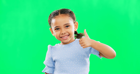 Image showing Thumbs up, green screen and portrait of child in agreement excited, winning and girl kid isolated in studio background. Yes, approval and young person with yes or thank you hands, gesture or sign