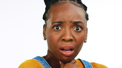 Image showing Face, fear, shocked, concerned and worried with a black woman in studio isolated on a white background looking afraid. Portrait, scared with a young female feeling alone, helpless or overwhelmed by e