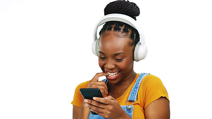 Image showing Black woman, music headphones and phone in studio online for communication, chat and shy flirting. African person smartphone and listening to sound typing on social media isolated on white background