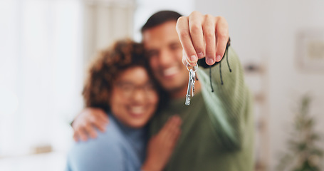 Image showing Hand, keys and a home owner couple proud of their real estate property investment or purchase. House, mortgage or beginning with a blurred background man and woman together in their new apartment