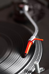 Image showing Closeup, turntable and vinyl for music system, professional dj job and needle for sound, party and vintage audio gear. Zoom, retro record player and disc for scratch, spinning and club for listening