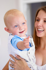 Image showing Happiness, love and curious baby with woman, growth and development in early childhood and family with care. Young mother, toddler and smile, parenting and bonding with motherhood and cute kid