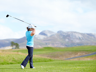 Image showing Driver, girl or golfer playing golf for fitness, workout or exercise with a swing on a green course. Wellness, woman golfing or athlete training in action or sports game driving with a club stroke