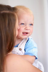 Image showing Woman, baby and bonding with love and care, growth and development in early childhood at family home. Young mother hug toddler, parenting and happiness, childcare with motherhood and cute kid