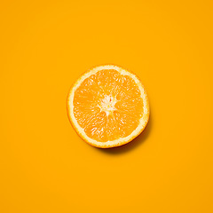 Image showing Orange, studio and slice of fruit for diet, vitamin C and healthy nutrition on isolated wallpaper or background. Food, organic and grocery for natural wellness, health and fruity citrus mockup